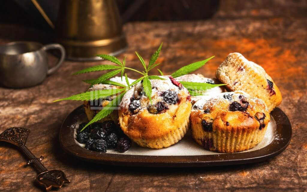 Homemade marijuana cupcake with berry fruits